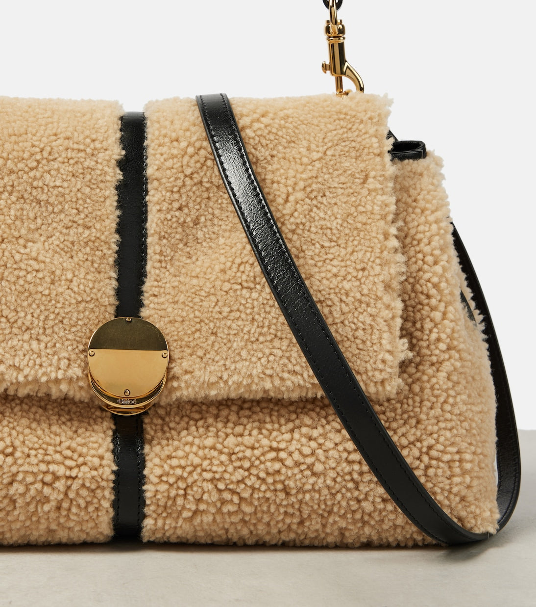 Penelope Medium shearling shoulder bag in beige - Chloe | iBrandZone